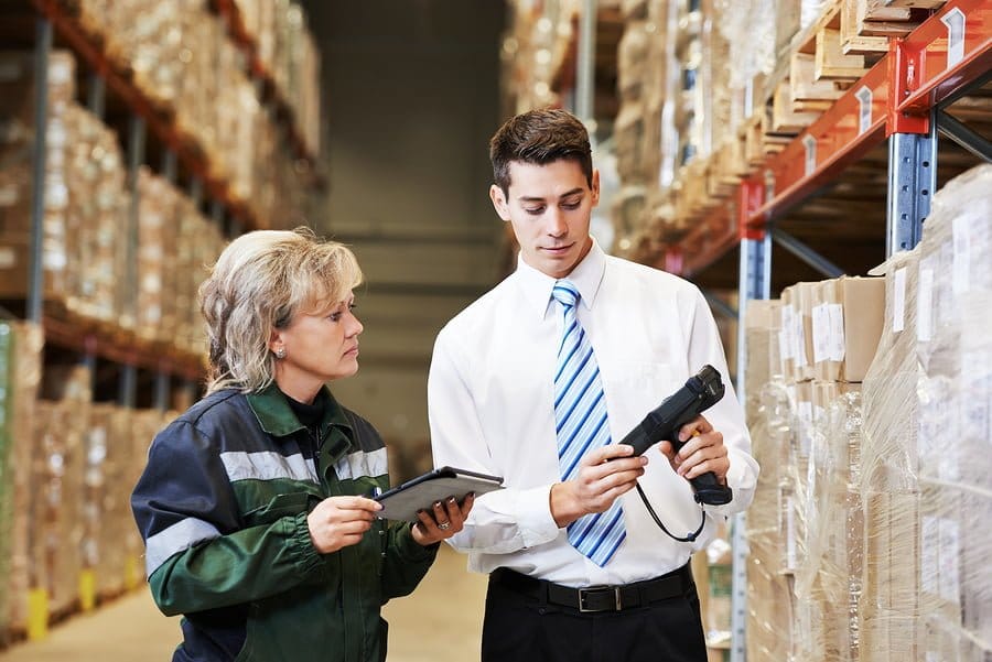 Warehouse staff checking inventory with scanner